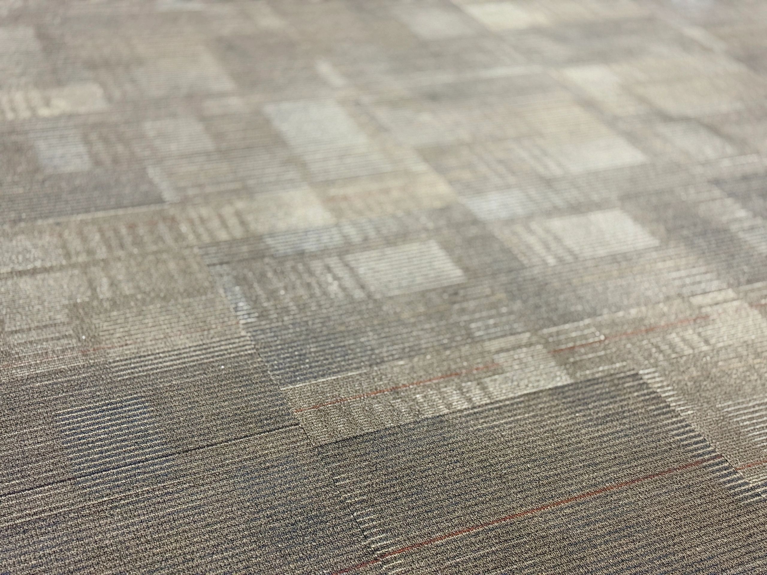Square carpet rug with a textured surface